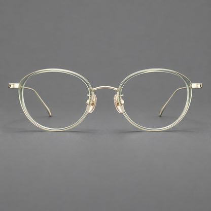 Round eyeglasses in acetate and titanium with a slim curved bridge and fine metal temples in Green / Gold, front view side view