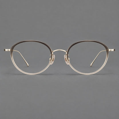 Round eyeglasses in acetate and titanium with a slim curved bridge and fine metal temples in Grey Tea Gradient / Gold, front view temple detail