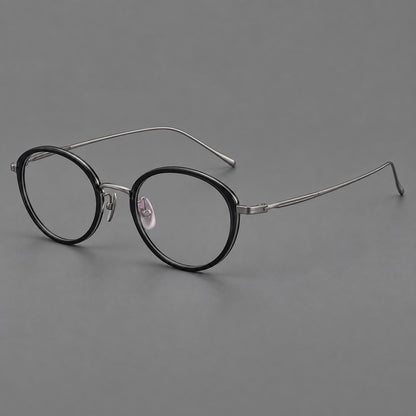Round eyeglasses in acetate and titanium with a slim curved bridge and fine metal temples in Glossy Black / Gunmetal, three quarter view additional product view