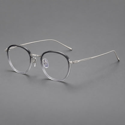 Vintage round eyeglasses in acetate and titanium with an engraved bridge and slender temples in Grey Gradient / Silver, three quarter view front view
