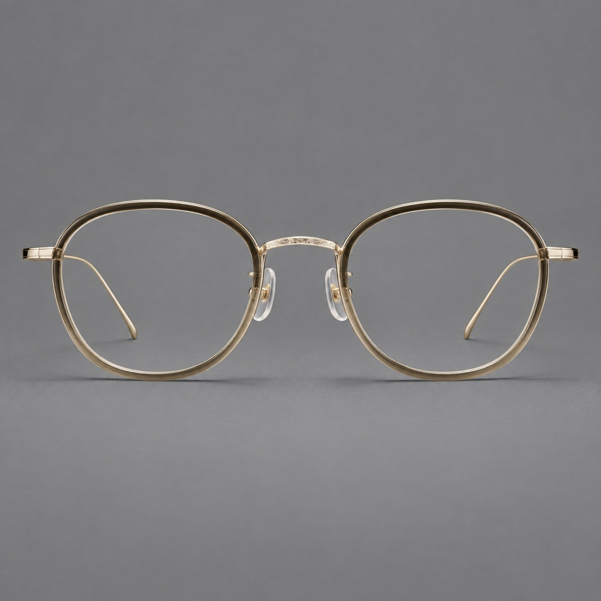 Vintage round eyeglasses in acetate and titanium with an engraved bridge and slender temples in Tea Gradient / Light Gold, front view