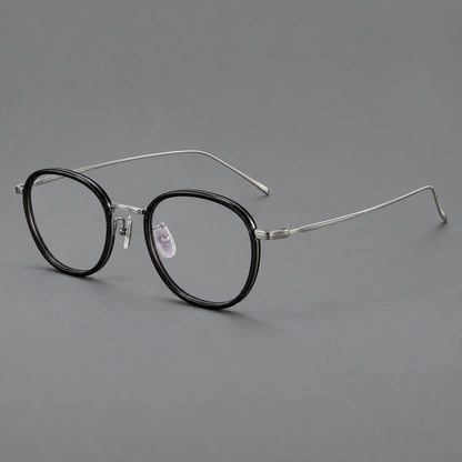 Vintage round eyeglasses in acetate and titanium with an engraved bridge and slender temples in Glossy Black / Gunmetal, three quarter view additional product view