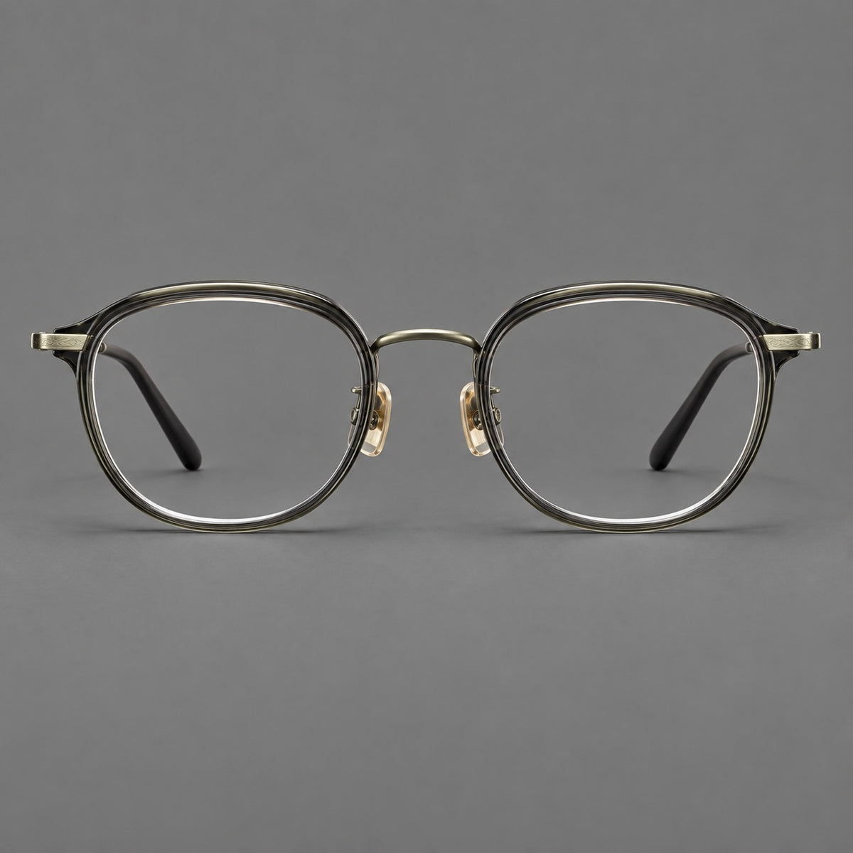 Soft square eyeglasses in acetate and titanium with rounded corners and decorative metal temples in Ice Grey Tortoiseshell / Antique Gold, front view