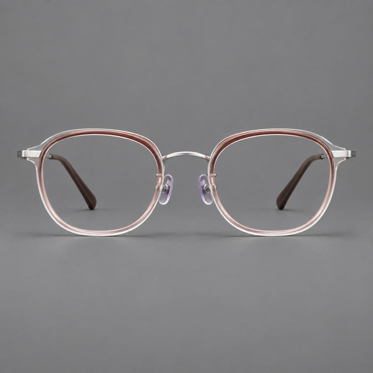 Soft square eyeglasses in acetate and titanium with rounded corners and decorative metal temples in Clear Tea Gradient / Silver, front view