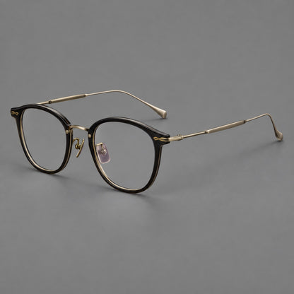 Panto eyeglasses in acetate and titanium with curved brows and decorative metal corner accents in Glossy Black / Antique Bronze, three quarter view additional product view