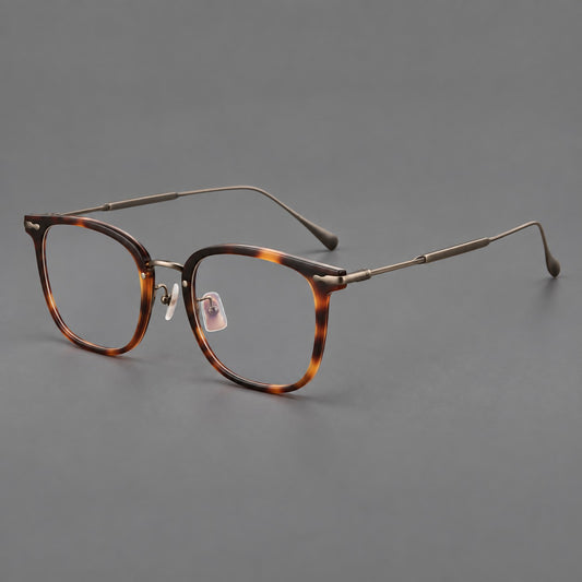Retro square eyeglasses in acetate and titanium with rounded edges and sculpted corner accents in Tortoiseshell / Antique Copper, three quarter view