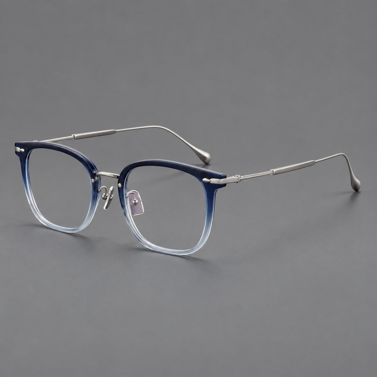 Retro square eyeglasses in acetate and titanium with rounded edges and sculpted corner accents in Blue Gradient / Silver, three quarter view