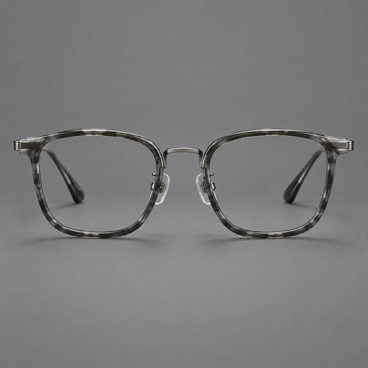 Soft square eyeglasses in acetate and titanium with wide upper corners and fine metal temples in Marbled Grey / Gunmetal, front view