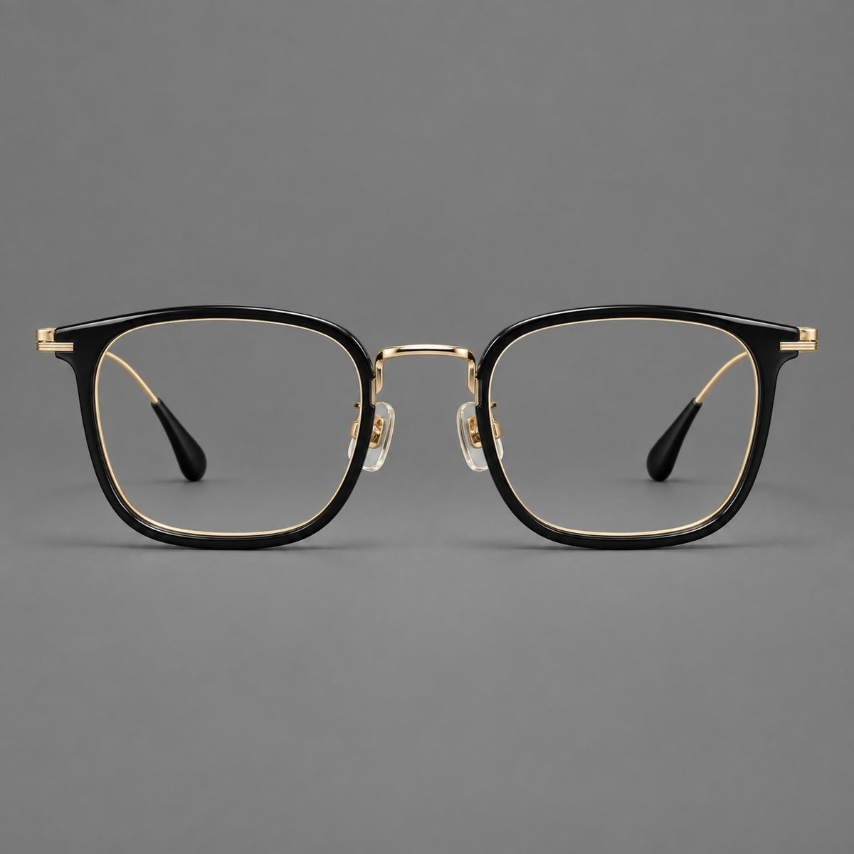 Soft square eyeglasses in acetate and titanium with wide upper corners and fine metal temples in Glossy Black / Gold, front view