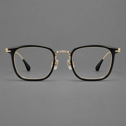 Soft square eyeglasses in acetate and titanium with wide upper corners and fine metal temples in Glossy Black / Gold, front view temple detail