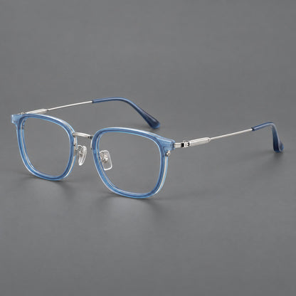 Soft square eyeglasses in acetate and titanium with wide upper corners and fine metal temples in Clear Blue / Silver, three quarter view additional product view