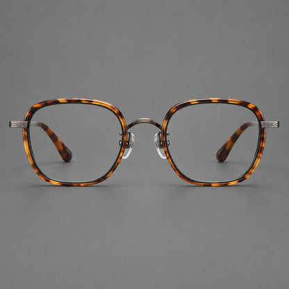 Rounded square eyeglasses in acetate and titanium with an arched bridge and engraved temples in Amber Tortoiseshell / Gunmetal, front view side view