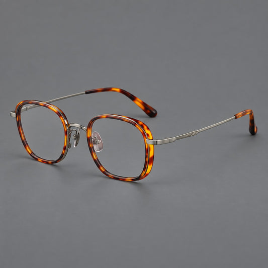 Rounded square eyeglasses in acetate and titanium with an arched bridge and engraved temples in Amber Tortoiseshell / Gunmetal, three quarter view