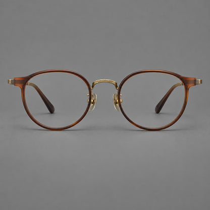 Round eyeglasses in acetate and titanium with widened outer corners and slender metal temples in Coffee Brown / Antique Bronze, front view additional product view