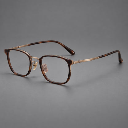 Rounded rectangular eyeglasses in acetate and titanium with bold corners and engraved metal temples in Coffee Brown / Antique Bronze, three quarter view additional product view