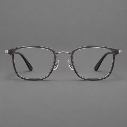 Rounded rectangular eyeglasses in acetate and titanium with bold corners and engraved metal temples in Clear Grey / Gunmetal, front view additional product view