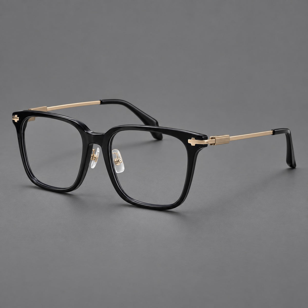 Classic acetate and titanium eyeglasses with broad square rims and textured metal temples in Black / Gold, three quarter view