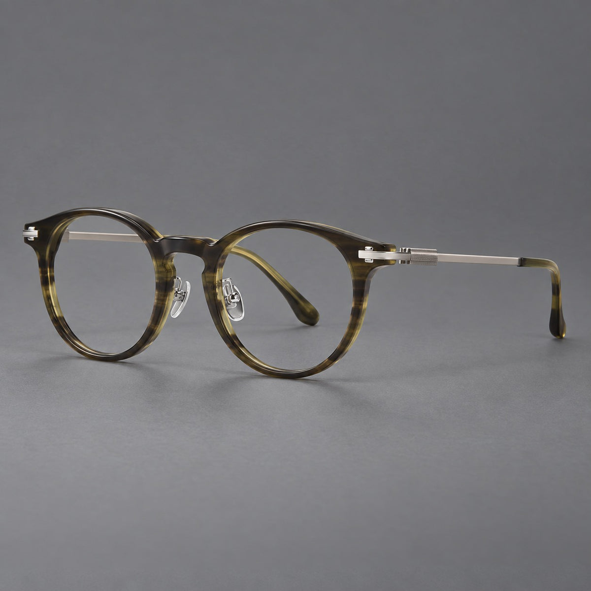 Retro acetate and titanium eyeglasses with round rims and a pronounced keyhole bridge in Olive Woodgrain / Silver, three quarter view