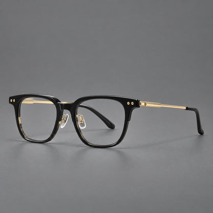 Classic acetate and titanium eyeglasses with squared brows and paired corner rivets in Black / Gold, three quarter view lens detail