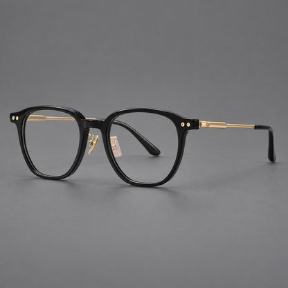 Vintage acetate and titanium eyeglasses with rounded square rims and slotted metal temples in Black / Gold, three quarter view