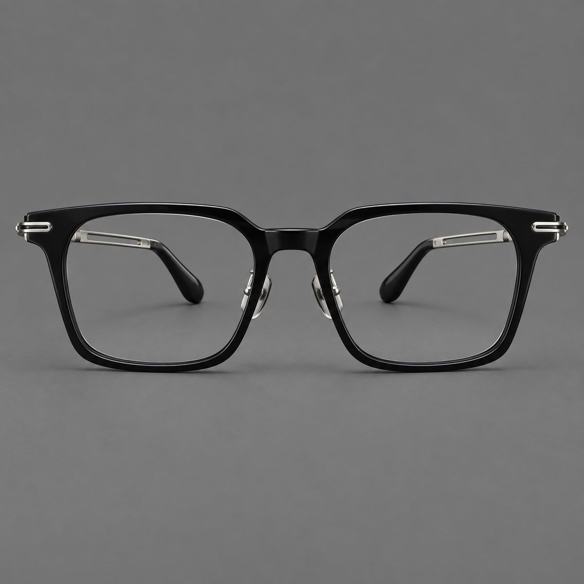Modern acetate and titanium eyeglasses with angular square rims and curved metal hinges in Black / Silver, front view