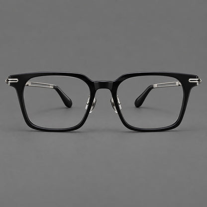 Modern acetate and titanium eyeglasses with angular square rims and curved metal hinges in Black / Silver, front view temple detail
