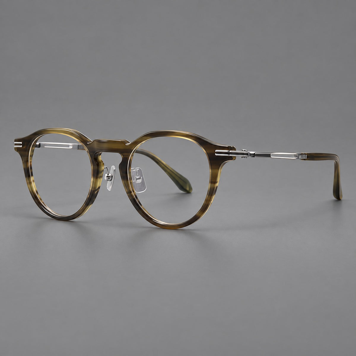 Retro acetate and titanium eyeglasses with round rims and distinctive looped metal joints in Striped Olive Green / Silver, three quarter view
