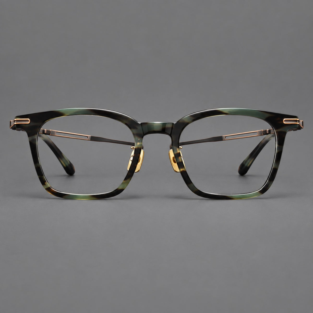 Acetate and titanium eyeglasses with rounded rectangular rims and sculpted open loop joints in Green Tortoiseshell / Antique Bronze, front view