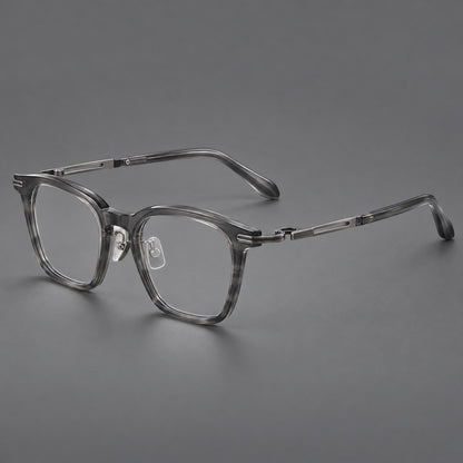 Acetate and titanium eyeglasses with rounded rectangular rims and sculpted open loop joints in Clear Grey / Brushed Grey, three quarter view lens detail