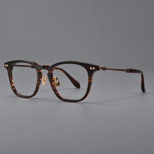 Retro acetate and titanium eyeglasses with gently squared rims and circular metal hinges in Striped Dark Brown / Antique Bronze, three quarter view