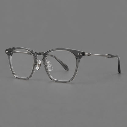 Retro acetate and titanium eyeglasses with gently squared rims and circular metal hinges in Clear Grey / Brushed Grey, three quarter view lens detail