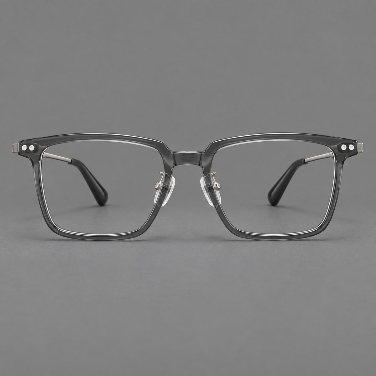 Classic acetate and titanium eyeglasses with a straight brow and rounded rectangular rims in Clear Grey / Silver, front view