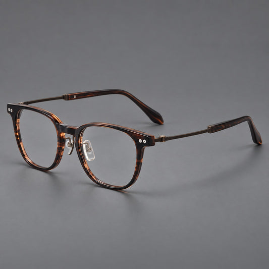 Vintage acetate and titanium eyeglasses with soft square rims and paired metal rivets in Striped Brown / Antique Bronze, three quarter view