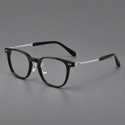 Vintage acetate and titanium eyeglasses with soft square rims and paired metal rivets in Black / Silver, three quarter view front view