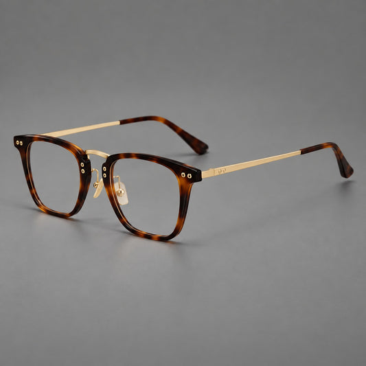 Acetate and titanium eyeglasses with soft square rims and an arched metal bridge in Tortoiseshell / Gold, three quarter view