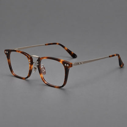 Acetate and titanium eyeglasses with angular rectangular rims and a curved metal bridge in Tortoiseshell / Gunmetal, three quarter view