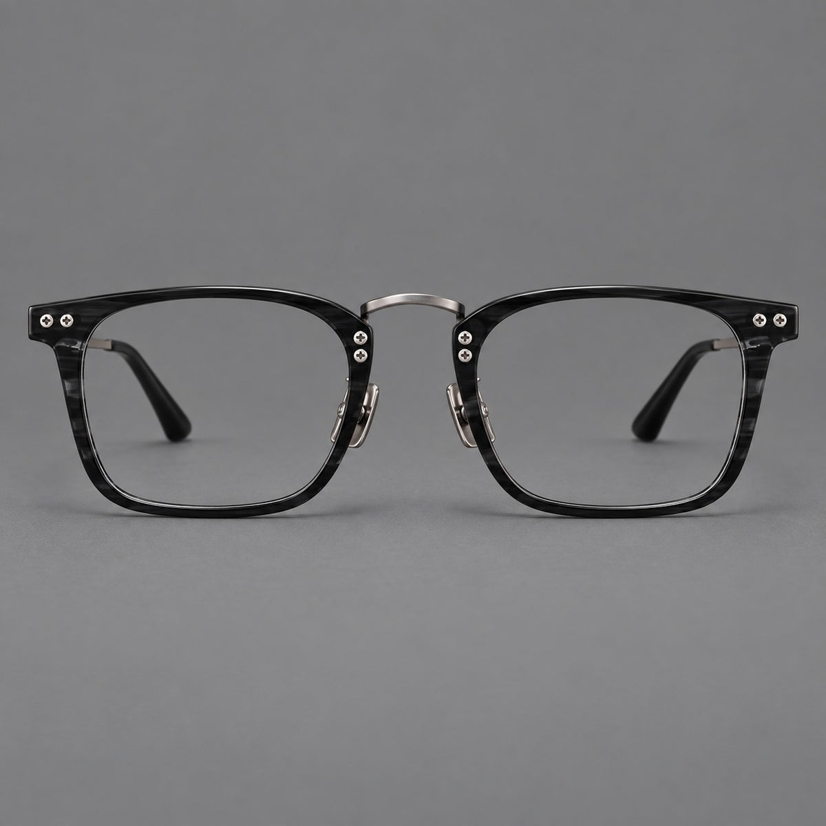 Acetate and titanium eyeglasses with angular rectangular rims and a curved metal bridge in Black / Gunmetal, front view