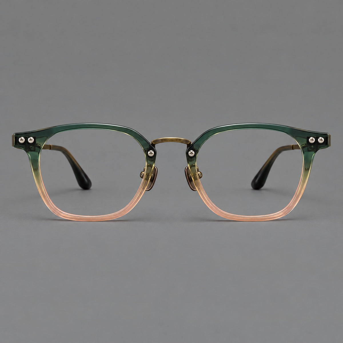 Retro acetate and titanium eyeglasses with softly rounded rims and a metal bridge in Green Pink Gradient / Antique Bronze, front view