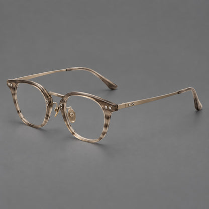 Retro acetate and titanium eyeglasses with softly rounded rims and a metal bridge in Light Grey Woodgrain, three quarter view lens detail