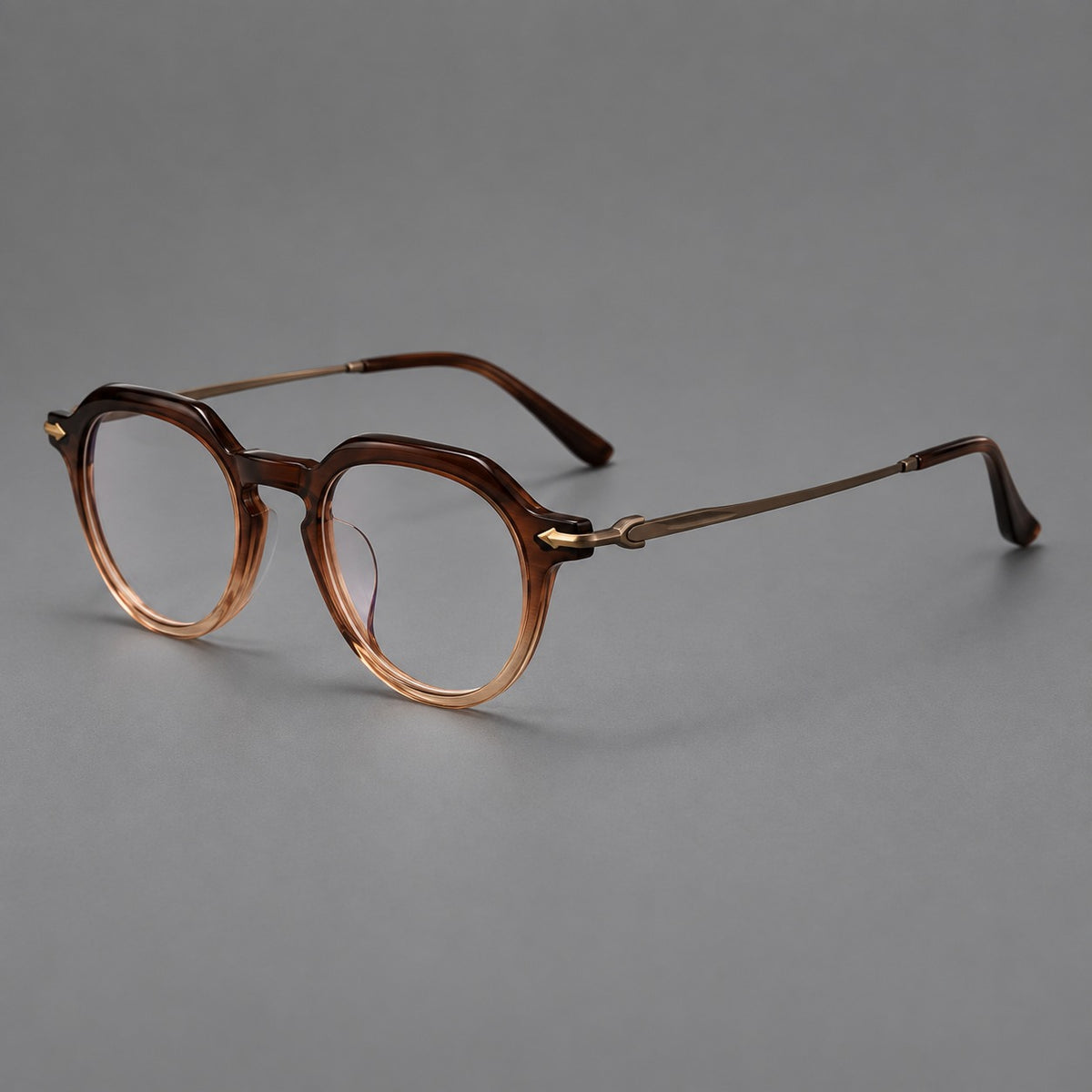 Retro acetate and titanium eyeglasses with panto rims and decorative arrow corner accents in Brown Gradient / Antique Bronze, three quarter view