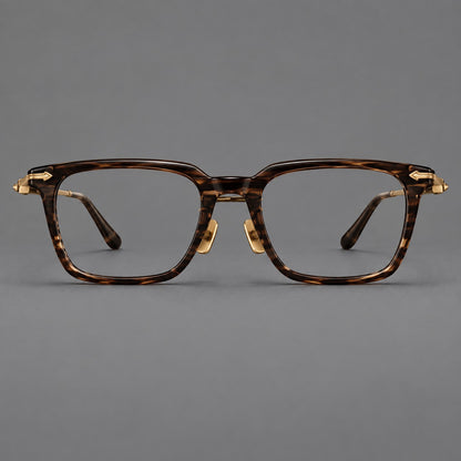 Bold acetate and titanium eyeglasses with rectangular rims and sculpted arrow accents in Tea Woodgrain / Antique Bronze, front view frame detail