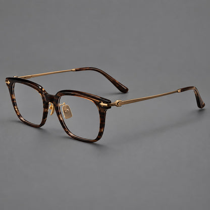 Bold acetate and titanium eyeglasses with rectangular rims and sculpted arrow accents in Tea Woodgrain / Antique Bronze, three quarter view front view