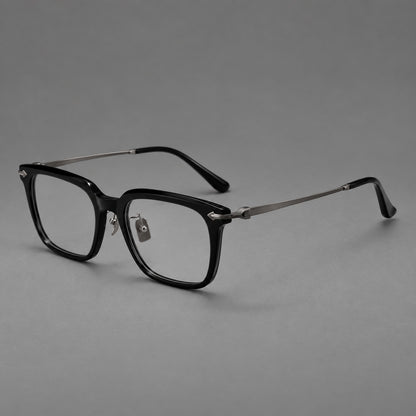 Bold acetate and titanium eyeglasses with rectangular rims and sculpted arrow accents in Black / Gunmetal, three quarter view lens detail