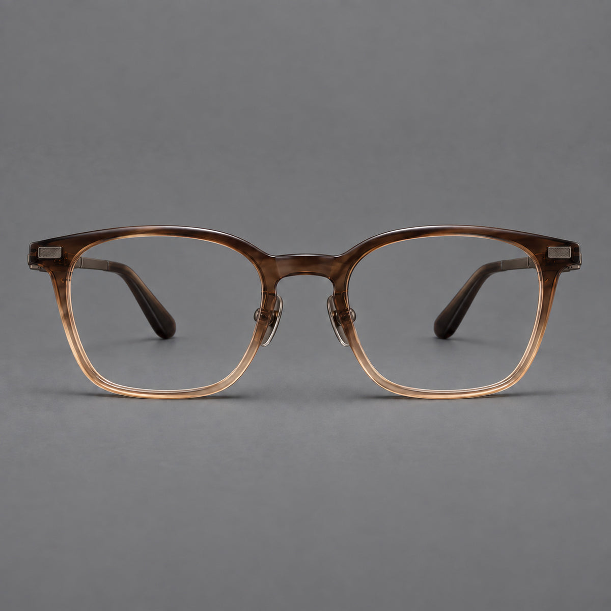 Classic acetate and titanium eyeglasses with rounded square rims and textured corner accents in Brown Gradient / Antique Bronze, front view