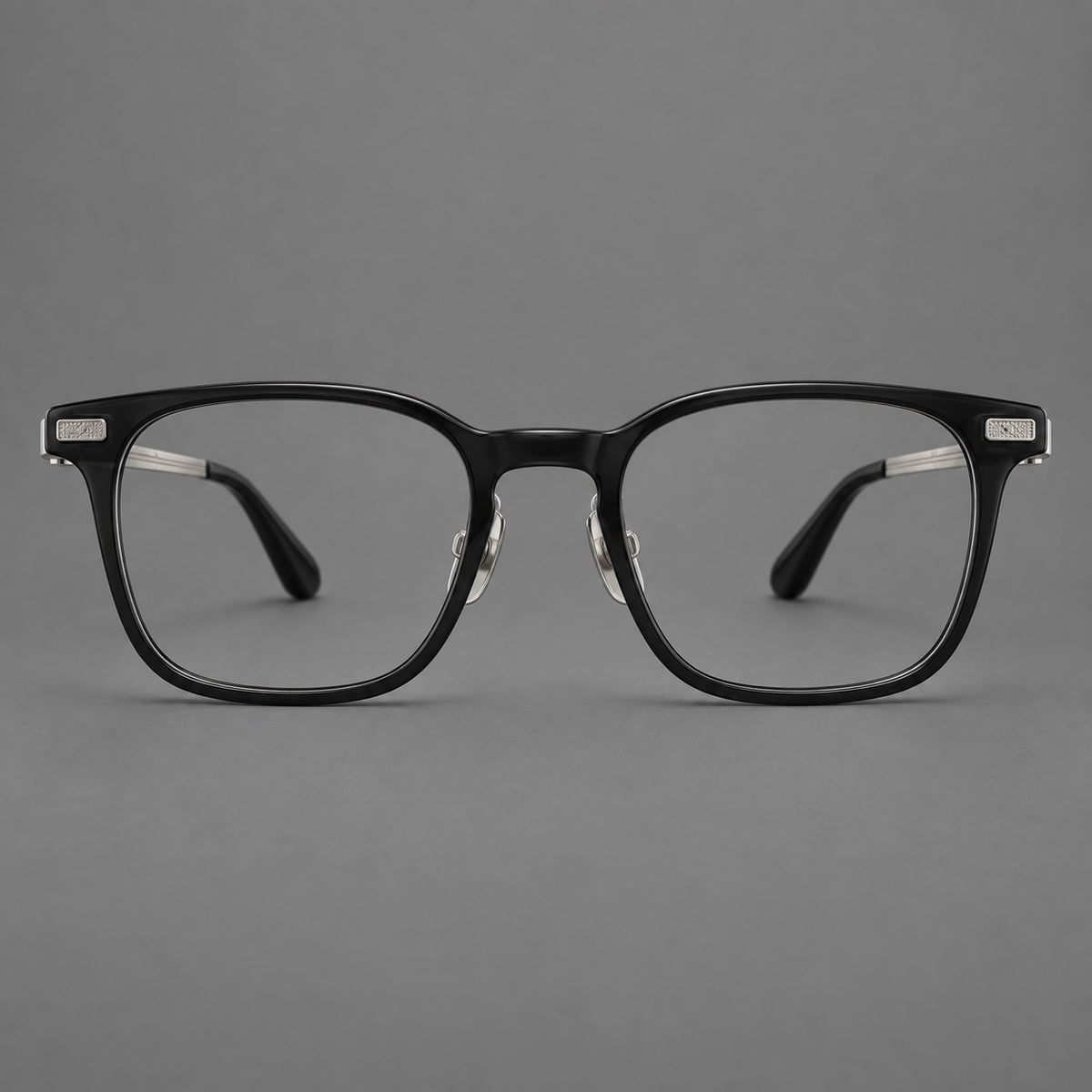 Classic acetate and titanium eyeglasses with rounded square rims and textured corner accents in Black / Silver, front view