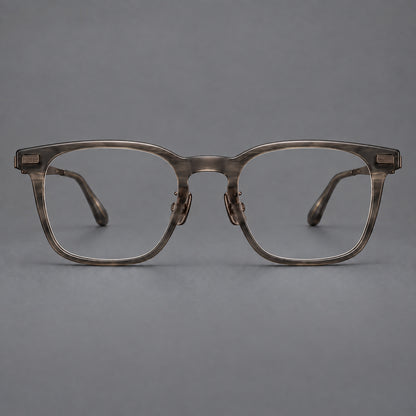 Classic acetate and titanium eyeglasses with rounded square rims and textured corner accents in Dark Grey / Antique Bronze, front view additional product view