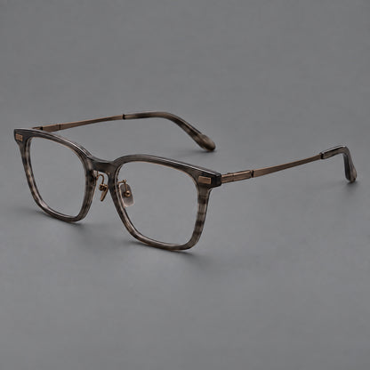 Classic acetate and titanium eyeglasses with rounded square rims and textured corner accents in Dark Grey / Antique Bronze, three quarter view additional product view