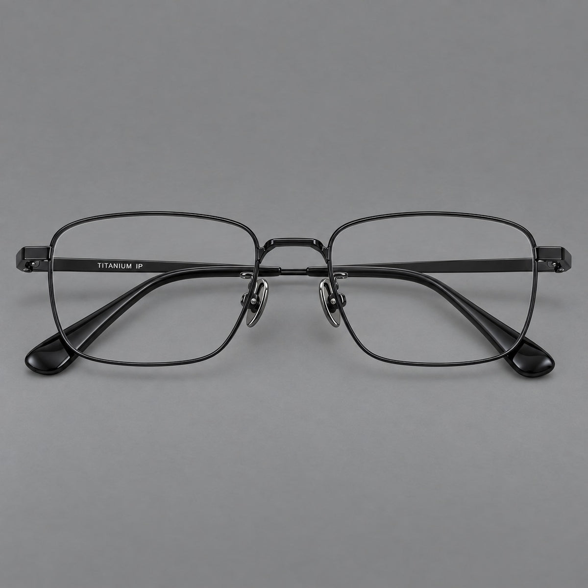 Modern square titanium glasses with an angular bridge and broad straight temples in Black, front view