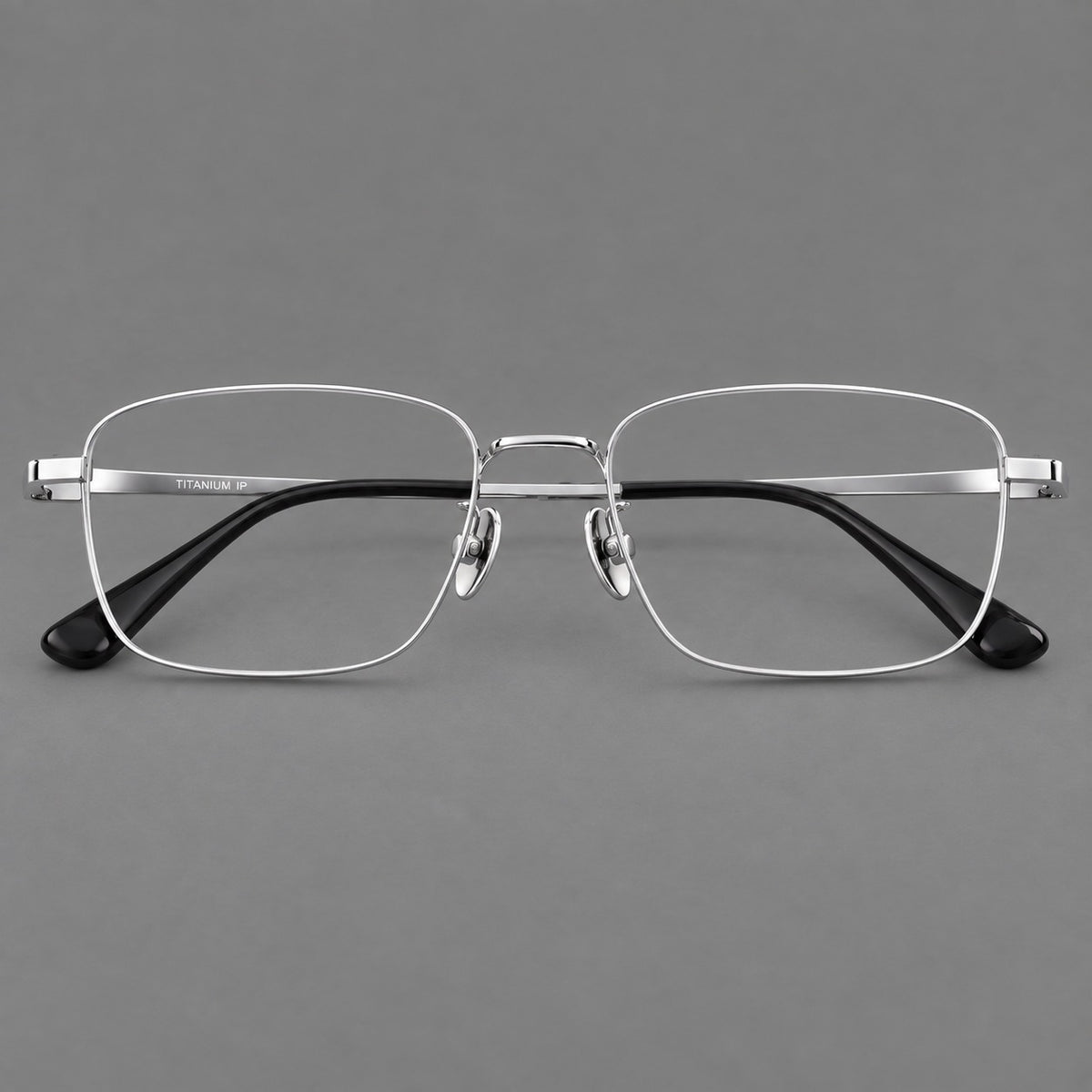 Modern square titanium glasses with an angular bridge and broad straight temples in Silver, front view