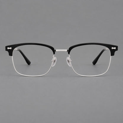 Classic browline titanium glasses with fine lower rims and subtle corner accents in Black and Silver, front view side view